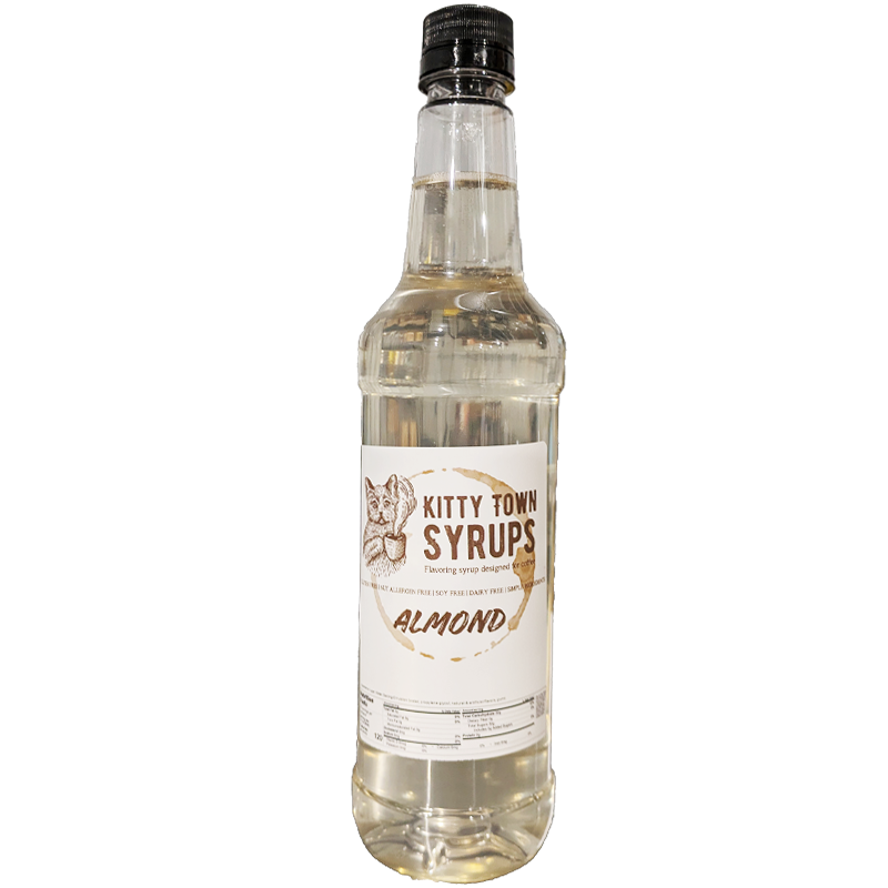 A plastic bottle of almond flavoring syrup with a label that reads 'Kitty Town Syrups Almond'.