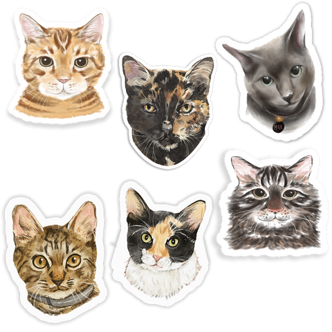 A set of stickers featuring various cat faces in different colors and poses.
