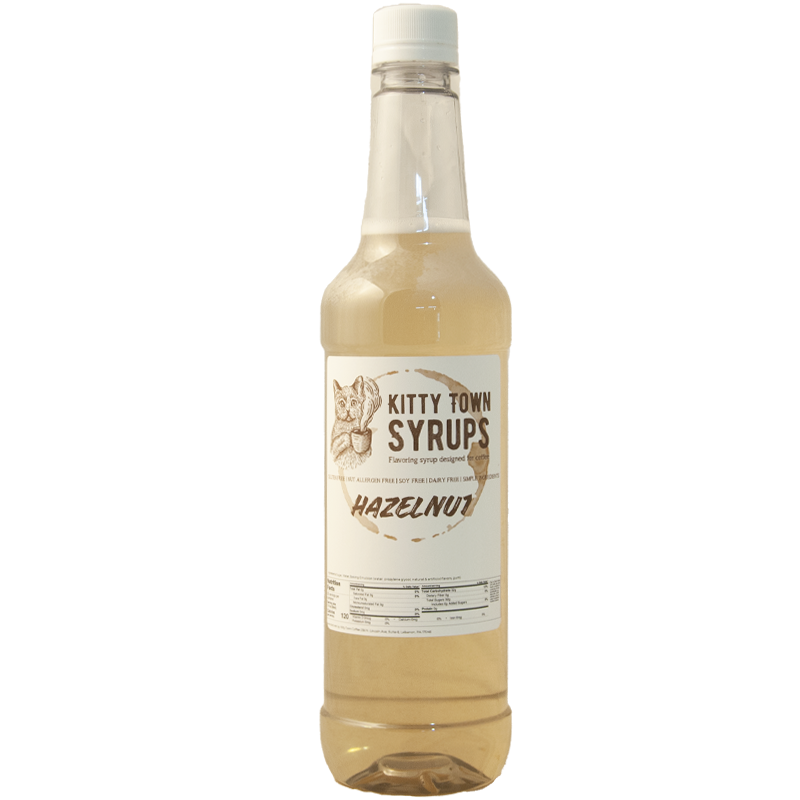 A bottle of Kitty Town Syrups hazelnut flavoring syrup.