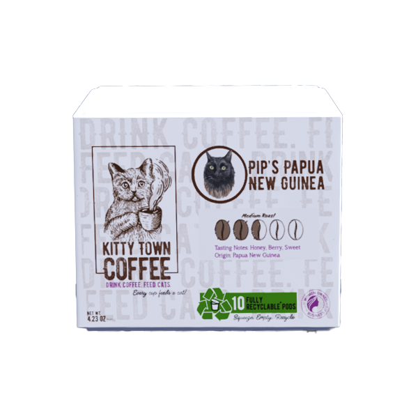 A box of Kitty Town Coffee single use pods featuring Pip's Papua New Guinea variety. The packaging has an illustration of a cat and details about the coffee.
