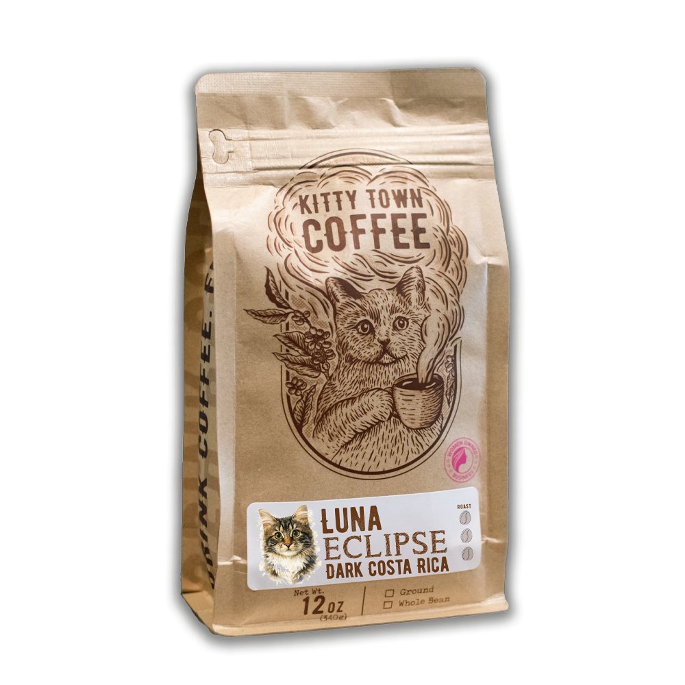 A 12 oz bag of Luna Eclipse Dark Costa Rica with the Kitty Town cat illustration and a photo of Luna