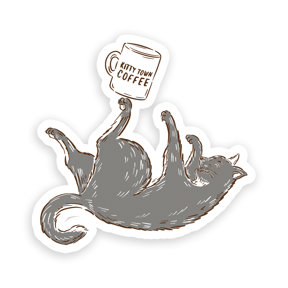 A sticker design featuring a cat lying down with a mug in its paw, and the text 'Kitty Town Coffee'.
