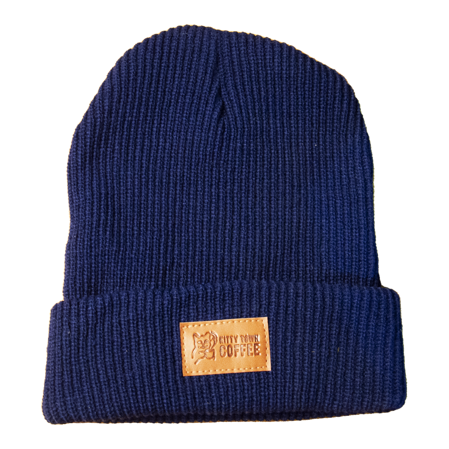 A navy blue knit beanie with a cuff and a rectangular brand tag on the side.