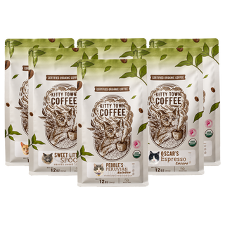 Six 12 oz bags of Kitty Town certified organic coffee arranged together