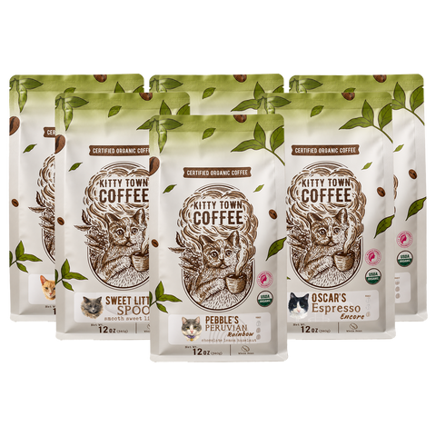 Six 12 oz bags of Kitty Town certified organic coffee arranged together