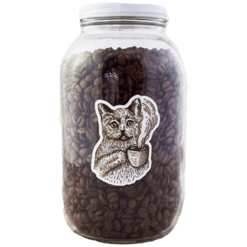 A 64oz glass jar filled with coffee beans, featuring a metal lid and a black and white illustration of a cat on the front.