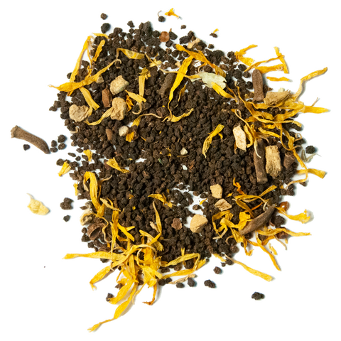 A blend of black tea leaves and spices including pieces of cinnamon, ginger, and star anise.