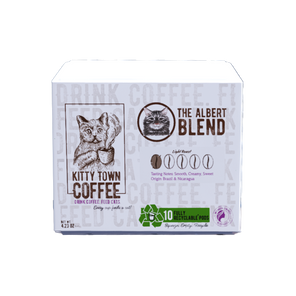 A box of 'The Albert Blend' coffee pods by Kitty Town Coffee, featuring a cat illustration and recyclable single use pod label.