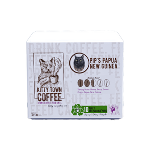 A box of Kitty Town Coffee single use pods featuring Pip's Papua New Guinea variety. The packaging has an illustration of a cat and details about the coffee.