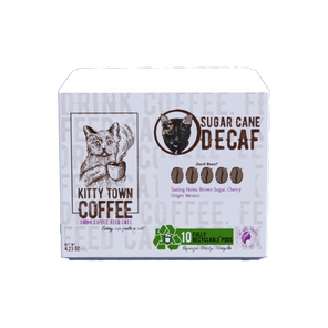A box of Kitty Town Coffee Sugar Cane Decaf coffee pods, with a graphic of a coffee bean and the recycling symbol indicating the pods are recyclable.