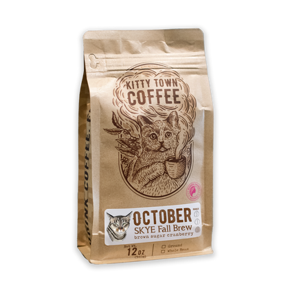 A bag of Kitty Town Coffee's October Skye Fall Brew, with an illustration of a cat and a mug