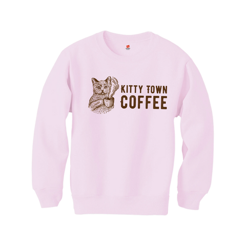 Pink sweatshirt with a cat graphic and 'Kitty Town Coffee' text on a white background