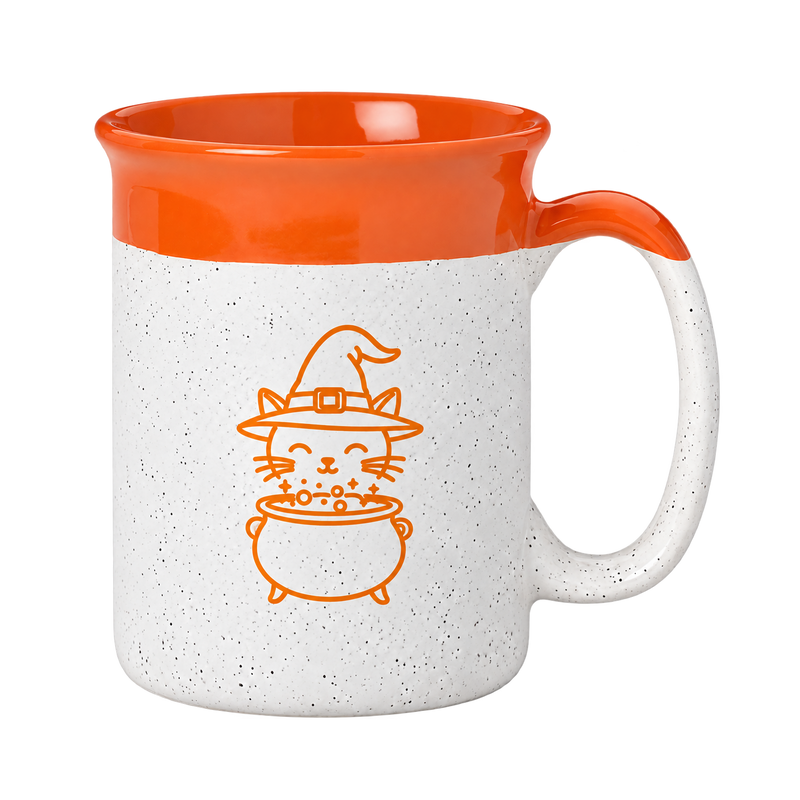 A ceramic mug with a speckled white exterior, a bright orange interior and handle, and an orange line-art illustration of a witch cat holding a cauldron on the front.