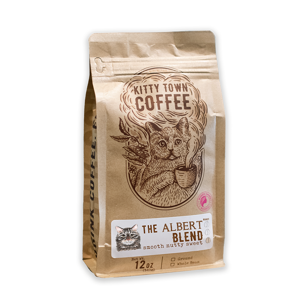 Packaged coffee labeled 'Kitty Town Coffee, The Albert Blend' featuring an illustration of a cat on the bag.