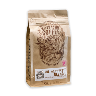 Packaged coffee labeled 'Kitty Town Coffee, The Albert Blend' featuring an illustration of a cat on the bag.
