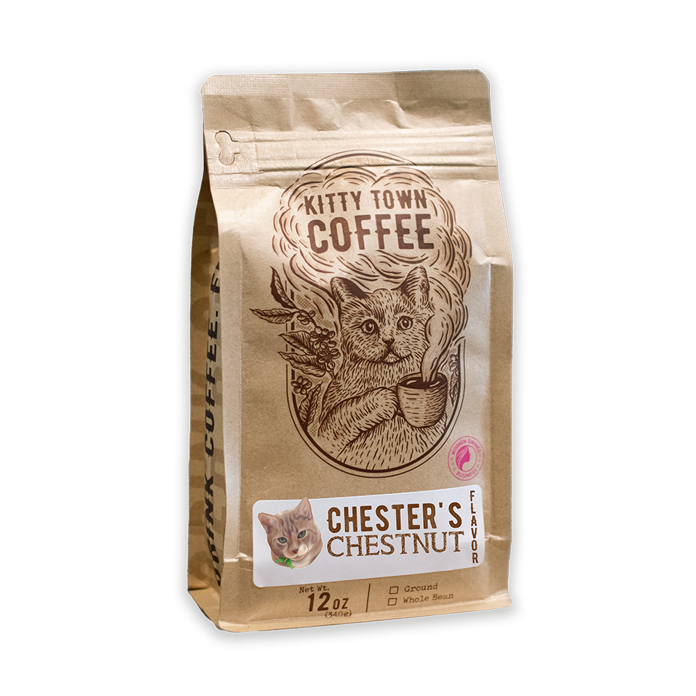 A packaged bag of Kitty Town Coffee's Chester's Chestnut flavored coffee with an illustration of a cat on the front.