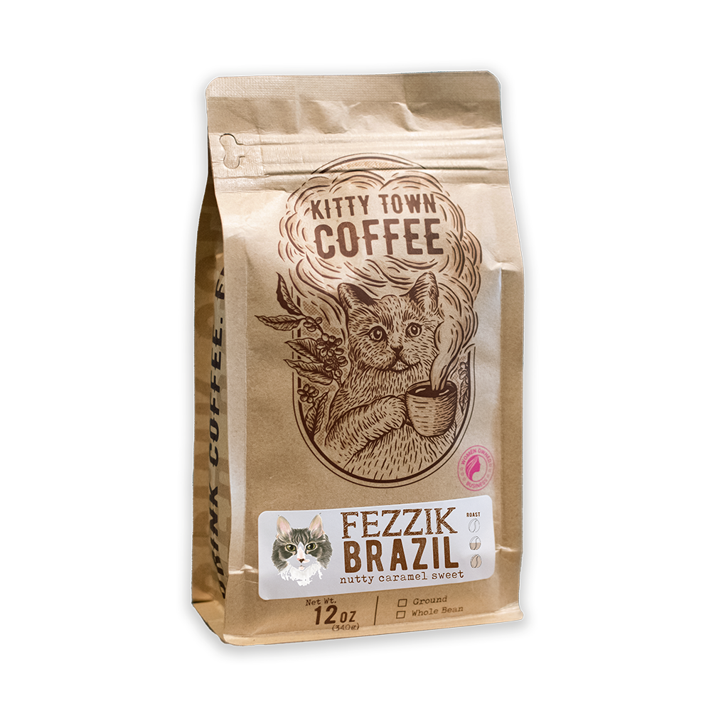 A packaged bag of Kitty Town Coffee's Fezzik Brazil medium roast coffee. The bag is brown with an illustration of a coffee bean and text.