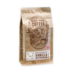 A package of Kitty Town Coffee featuring Wolfgang's Vanilla Buttercream flavored coffee, with an illustration of a coffee bean and a cat on the bag.